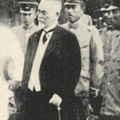 Photograph: Inspection tour of the Prince Regent, Hirohito, receiving reports from the Mayor of Tokyo, Chief of the Metropolitan Police Board and Home Minister, at Ueno Park.