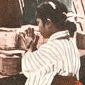 Postcard: People praying for the dead in front of a large mound of ash at the site of the Honjo Clothing Depot